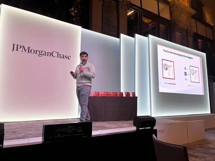 Javed Khattak speaking on stage at JPMorganChase